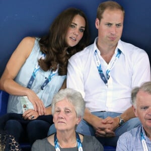 Le prince William, Catherine Kate Middleton, la duchesse de Cambridge et le prince Harry assistent à l'épreuve de natation aux XXèmes Jeux du Commonwealth à Glasgow, le 28 juillet 2014. 