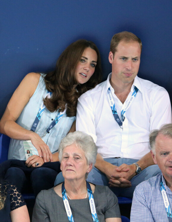 Le prince William, Catherine Kate Middleton, la duchesse de Cambridge et le prince Harry assistent à l'épreuve de natation aux XXèmes Jeux du Commonwealth à Glasgow, le 28 juillet 2014. 