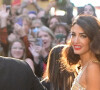 George Clooney et sa femme Amal arrivent à la soirée "Albie Awards" de leur fondation à la biblithèque de New York, le 29 septembre 2022. Les Albie Awards sont décernés par la "Clooney Foundation For Justice". 