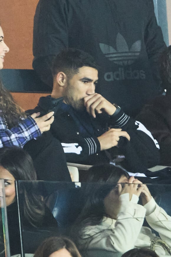 Achraf Hakimi (mise en examen pour viol) assiste dans les tribunes au match du PSG face à Nantes (4-2) au Parc des Princes à Paris le 4 mars 2023. © Cyril Moreau / Bestimage