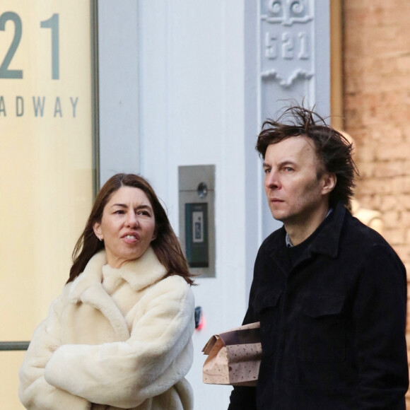 Exclusif - Sofia Coppola se promène avec son mari Thomas Mars et leur fille à New York le 19 décembre 2022.