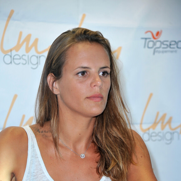 Laure Manaudou présente sa collection de maillots de bain 'Laure Manaudou Design' lors d'un défilé à la Piscine de Boulogne-Billancourt le 2 Juillet 2014.