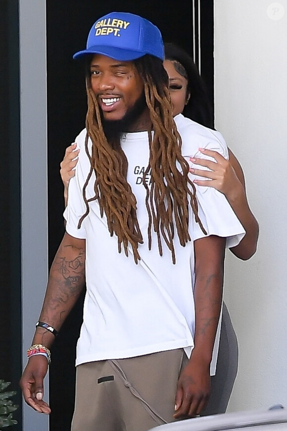 Exclusif - Le Rappeur Fetty Wap et une mystérieuse brunette à la sortie d'un hôtel de Miami Beach, Etats-Unis le 15/07/2022.