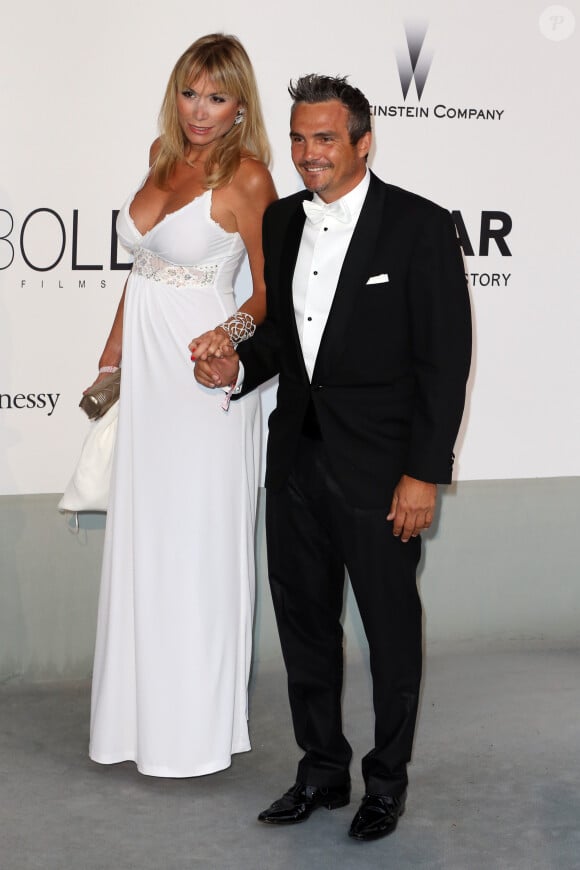 Richard Virenque et sa compagne Marie-Laure - Photocall de la soirée "AmfAR's 21st Cinema Against AIDS" à l'Eden Roc au Cap d'Antibes lors du 67ème festival du film de Cannes, le 22 mai 2014.