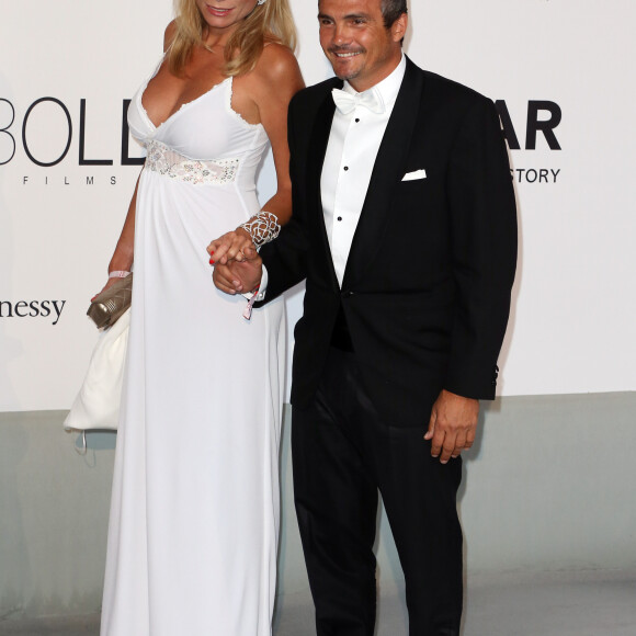 Richard Virenque et sa compagne Marie-Laure - Photocall de la soirée "AmfAR's 21st Cinema Against AIDS" à l'Eden Roc au Cap d'Antibes lors du 67ème festival du film de Cannes, le 22 mai 2014.