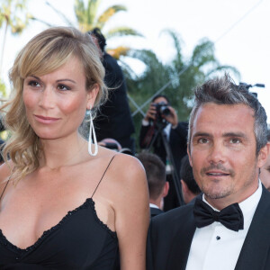 Le couple s'est notamment rendu au Festival de Cannes en 2014 et on a pu constater cette différence de taille

Richard Virenque et sa compagne Marie-Laure - Montée des marches du film "Deux jours, une nuit" lors du 67 ème Festival du film de Cannes – Cannes le 20 mai 2014.