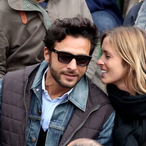 Maxim Nucci (Yodelice) et sa compagne Isabelle Ithurburu dans les tribunes des Internationaux de France de tennis de Roland Garros à Paris. Le 24 mai 2016 © Dominique Jacovides / Bestimage