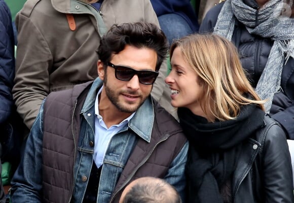 Maxim Nucci (Yodelice) et sa compagne Isabelle Ithurburu dans les tribunes des Internationaux de France de tennis de Roland Garros à Paris. Le 24 mai 2016 © Dominique Jacovides / Bestimage