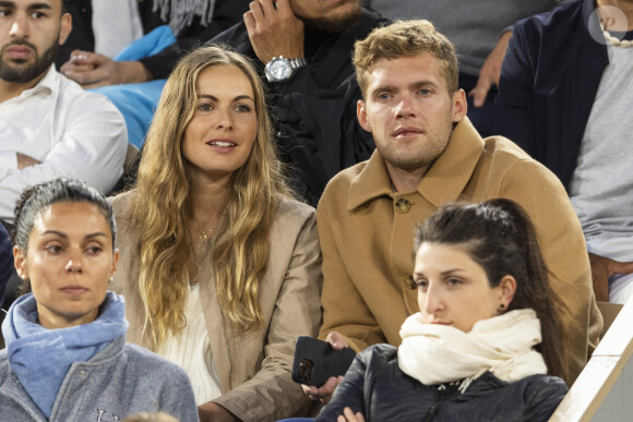 Kevin Mayer et sa compagne Delphine Jariel - Célébrités dans les tribunes des internationaux de France de Roland Garros à Paris le 31 mai 2022. © Cyril Moreau - Dominique Jacovides/Bestimage