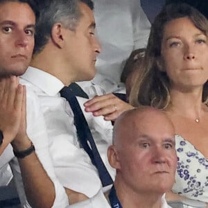 Gabriel Attal, Gérald Darmanin, ministre de l'Intérieur et sa femme Rose-Marie Devillers - People dans les tribunes lord du match d'ouverture de la Coupe du Monde de Rugby France 2023 avant le match de la Poule A entre la France et la Nouvelle-Zélande au Stade de France à Saint-Denis le 8 septembre 2023. © Dominique Jacovides/Bestimage