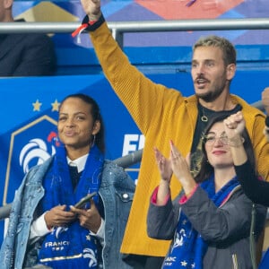 Et Christina Milian adore la vie parisienne 
M. Pokora (Matt Pokora), sa femme Christina Milian assistent au match de la 5ème et avant-dernière journée de Ligue des nations entre la France et l'Autriche (2-0) au Stade de France à Saint-Denis le 22 septembre 2022. 