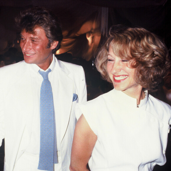 Nathalie Baye et Johnny Hallyday au mariage d'Eddie Barclay chez Castel à Paris le 22 juin 1984