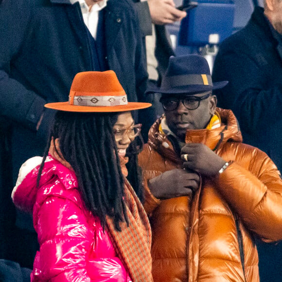 Lilian Thuram et sa femme Kareen Guiock - People dans les tribunes du quart de finale de la coupe de France de football entre le Paris Saint-Germain et l'OGC Nice (3-1) au Parc des Princes à Paris le 13 mars 2024. © Cyril Moreau/Bestimage