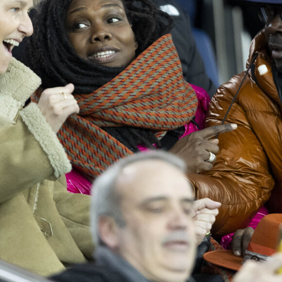 Lilian Thuram et sa femme Kareen Guiock - People dans les tribunes du quart de finale de la coupe de France de football entre le Paris Saint-Germain et l'OGC Nice (3-1) au Parc des Princes à Paris le 13 mars 2024. © Cyril Moreau/Bestimage
