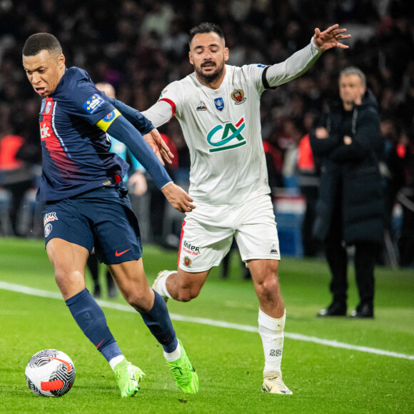 Kylian Mbappé (Paris SG) Gaetan Laborde (OGC Nice) - Quart de finale de la coupe de France de football entre le Paris Saint-Germain et l'OGC Nice (3-1) au Parc des Princes à Paris le 13 mars 2024. 