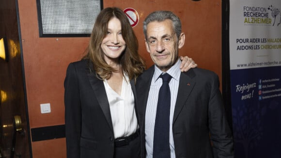 PHOTOS Carla Bruni-Sarkozy très tendre avec son époux Nicolas Sarkozy, un bisou volé parmi une foule de stars