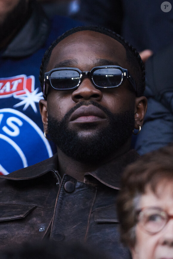 Tayc - Célébrités dans les tribunes de la demi-finale retour de Ligue des champions entre le PSG face au Borussia Dortmund (0-1) au Parc des Princes à Paris le 7 mai 2024. © Cyril Moreau/Bestimage