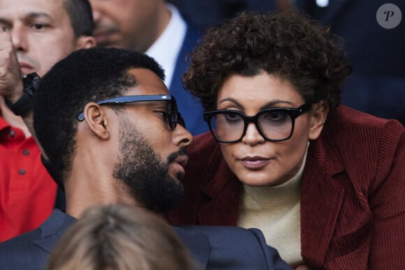 Nawell Madani et son compagnon Djebril Didier Zonga - Célébrités dans les tribunes de la demi-finale retour de Ligue des champions entre le PSG face au Borussia Dortmund (0-1) au Parc des Princes à Paris le 7 mai 2024. © Cyril Moreau/Bestimage