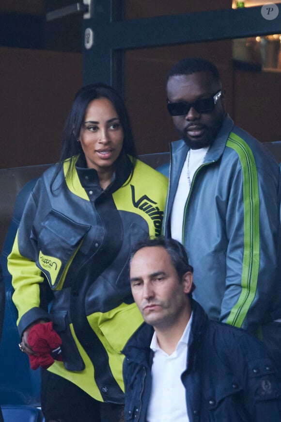 Gims et sa femme Demdem - Célébrités dans les tribunes de la demi-finale retour de Ligue des champions entre le PSG face au Borussia Dortmund (0-1) au Parc des Princes à Paris le 7 mai 2024. © Cyril Moreau/Bestimage