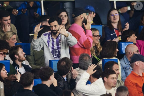 Big Flo et Oli - Célébrités dans les tribunes du match de Ligue 1 Uber Eats "PSG-Toulouse" (1-3) au Parc des Princes à Paris le 12 mai 2024. © Cyril Moreau/Bestimage