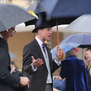 Le prince William, prince de Galles, et les invités lors de la "Garden Party du Souverain" au palais de Buckingham à Londres, le 21 mai 2024. 