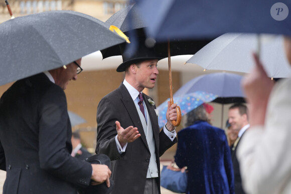 Le prince William, prince de Galles, et les invités lors de la "Garden Party du Souverain" au palais de Buckingham à Londres, le 21 mai 2024. 