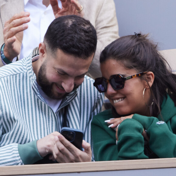 Inès Reg (Inès Reghioua) avec son meilleur ami Mickaël Montadir dans les tribunes au même moment dans les tribunes des Internationaux de France de tennis de Roland Garros 2024 à Paris, France, le 3 juin 2024. © Jacovides-Moreau/Bestimage  Celebs in the stands of the French Open tennis tournament at Roland Garros 2024 in Paris, France, on June 3, 2024. 