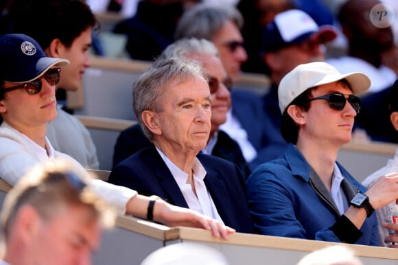 Bernard Arnault et ses fils Frédéric et Alexandre - Célébrités dans les tribunes de la finale homme des Internationaux de France de tennis de Roland Garros 2024 à Paris le 9 juin 2024. © Jacovides-Moreau/Bestimage 