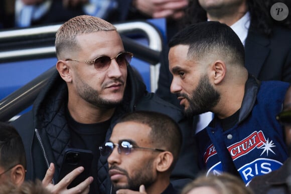 Dj Snake et Malik Bentalha - Célébrités dans les tribunes de la demi-finale retour de Ligue des champions entre le PSG face au Borussia Dortmund (0-1) au Parc des Princes à Paris le 7 mai 2024. © Cyril Moreau/Bestimage