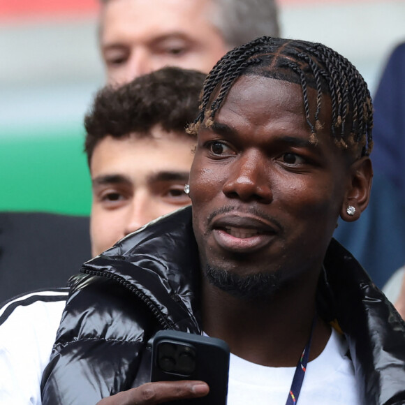 Paul Pogba et Lilian Thuram - Célébrités dans les tribunes du huitième de finale de l'Euro 2024 entre la France et la Belgique (1-0) à Dusseldorf le 1er juillet 2024.