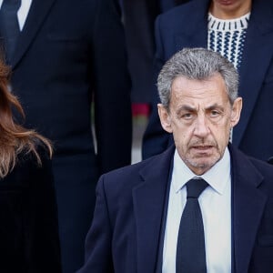 Carla Bruni, son mari Nicolas Sarkozy - Sorties des obsèques de Jean-Pierre Pernaut en la Basilique Sainte-Clotilde à Paris, France le 9 mars 2022. © Aurelien Morissard/Panoramic/Bestimage 