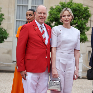 Le prince Albert II de Monaco et la princesse Charlène de Monaco - Emmanuel Macron, Président de la République Française, et la Première dame Brigitte Macron, accueillent les chefs d'Etat et de gouvernement présents à Paris pour la cérémonie d'ouverture des Jeux Olympiques de Paris 2024 (JO).  © Dominique Jacovides- Pierre Perusseau /Bestimage 