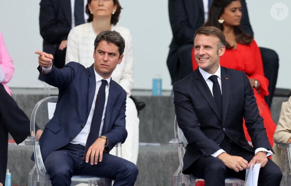 Gabriel Attal, Emmanuel Macron en tribune présidentielle lors de la cérémonie du 144ème défilé militaire du 14 juillet, jour de la Fête Nationale, avenue Foch à Paris, France, le 14 juillet 2024. © Dominique Jacovides/Bestimage 