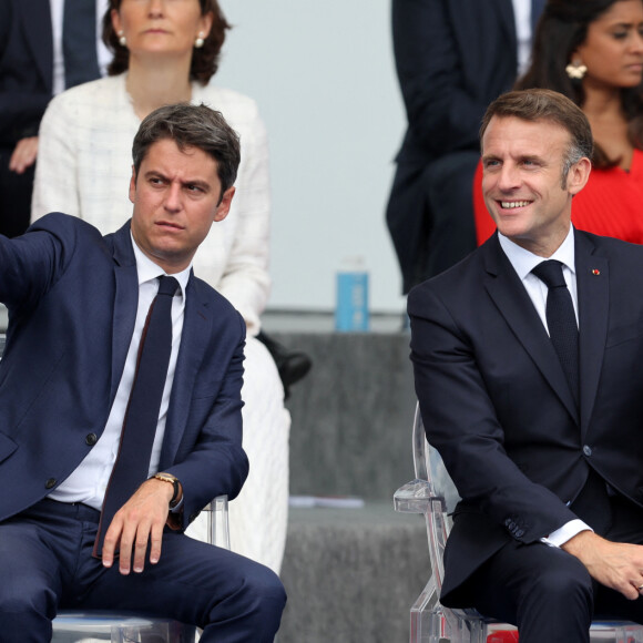 Gabriel Attal, Emmanuel Macron en tribune présidentielle lors de la cérémonie du 144ème défilé militaire du 14 juillet, jour de la Fête Nationale, avenue Foch à Paris, France, le 14 juillet 2024. © Dominique Jacovides/Bestimage 