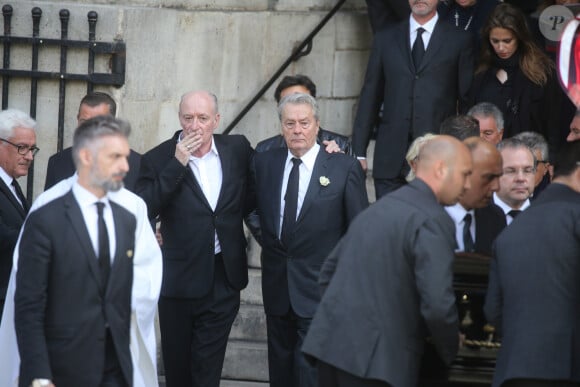 Pascal Desprez, Alain Delon - Sorties des obsèques de Mireille Darc en l'église Saint-Sulpice à Paris. Le 1er septembre 2017 