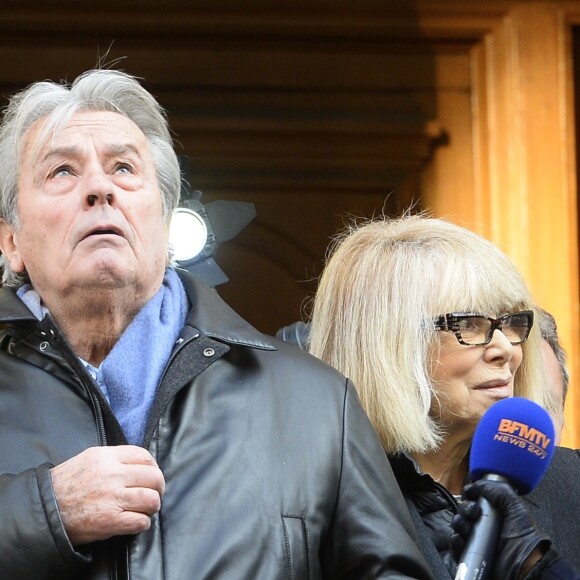 Alain Delon et Mireille Darc - Hommage a Georges Lautner en l'eglise Saint-Roch a Paris. Le 5 decembre 2013