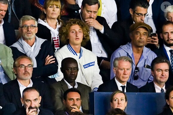 Yannick Noah et son fils Joalukas  en tribunes du match de football en ligue 1 Uber Eats au Parc des Princes à Paris le 19 septembre 2021