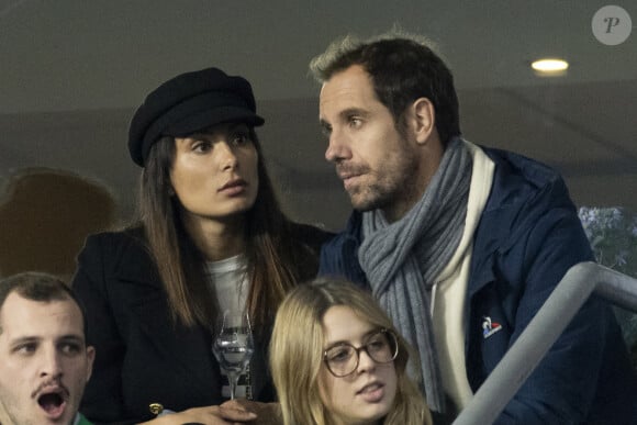 Richard Gasquet et sa compagne Clementine dans les tribunes lors de la demi-finale de la Coupe du Monde de Rugby opposant l'Argentine à la Nouvelle Zélande (6 - 44) au Stade de France à Saint-Denis, France, le 20 octobre 2023. © Cyril Moreau/Bestimage