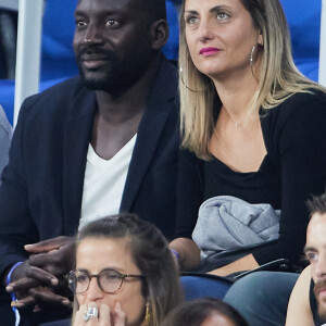 Ladji Doucouré avec sa compagne dans les tribunes du match de Coupe du monde de rugby opposant l'Irlande à l'Ecosse (36-14) au stade de France à Saint-Denis, proche Paris, Seine Saint-Denis, France, le 7 octobre 2023. © Jacovides-Moreau/Bestimage