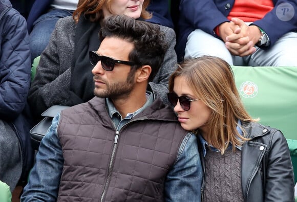 Maxim Nucci (Yodelice) et sa compagne Isabelle Ithurburu dans les tribunes des Internationaux de France de tennis de Roland Garros à Paris. Le 24 mai 2016 © Dominique Jacovides / Bestimage