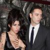 Amy Winehouse et son nouveau petit ami, Reg, assistent à l'inauguration d'un restaurant africain à Londres, mercredi 4 août.