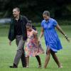 Barack et Michelle Obama arrivent avec leur fille cadette Sasha à Washington le 15 août après un séjour d'une journée à Panama City