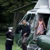 Barack et Michelle Obama arrivent avec leur fille cadette Sasha à Washington le 15 août après un séjour d'une journée à Panama City