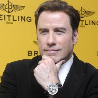 John Travolta : Entre joie et tristesse, il vend des montres en Russie !