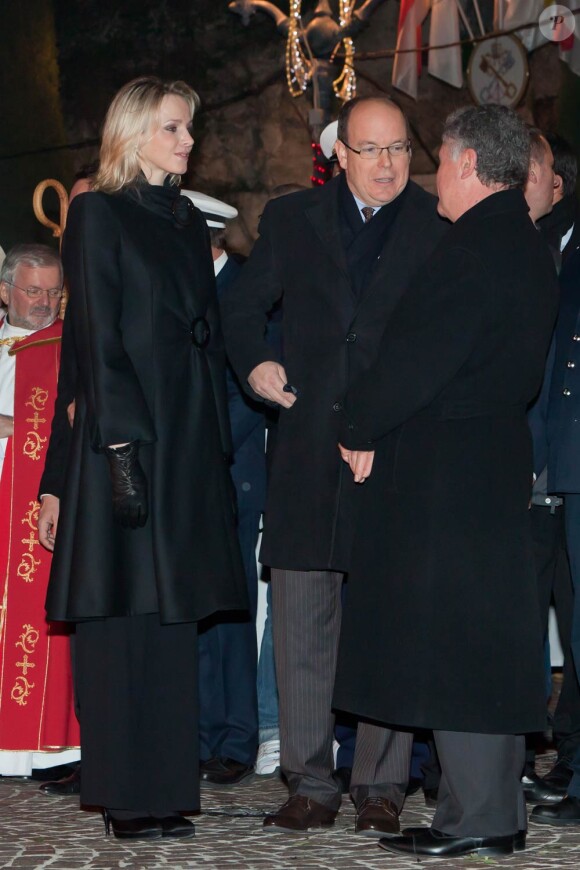 Charlene, Albert et Caroline de Monaco durant les célébrations de la Sainte-Dévote, le 26 janvier 2011.