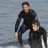 Sean Penn et son fils Hopper, font du surf le 23 janvier 2011