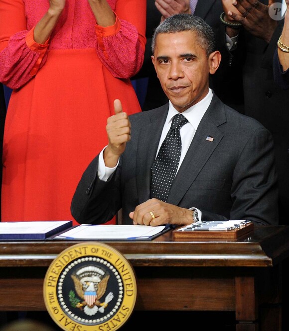 Barack Obama n'en veut visiblement pas à sa femme Michelle, Einsenhower Building à Washington, le 21 novembre 2011.