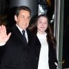 Carla Bruni et Nicolas Sarkozy arrivent dans les locaux de TF1 où le président annoncera sa candidature sur le plateau du JT, le 15 février 2012.