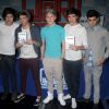One Direction - Harry Styles, Louis Tomlinson, Niall Horan, Liam Payne et Zayn Malik - dans un magasin de disques new-yorkais, le 12 mars 2012.