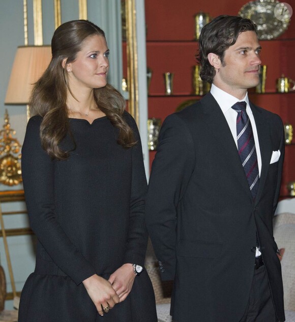 La princesse Madeleine et le prince Carl Philip de Suède lors du déjeuner donné au palais royal de Stockholm pour le prince Charles et la duchesse Camilla, le 23 mars 2012.